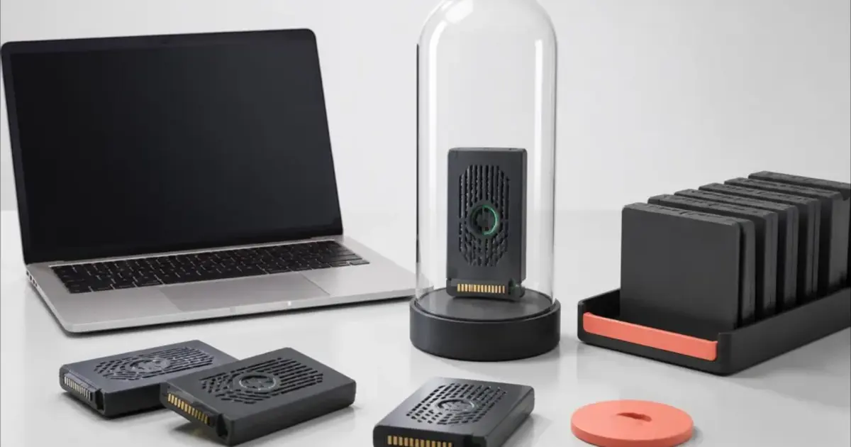 A Mac beside removable local AI model cartridges with one custom model protected